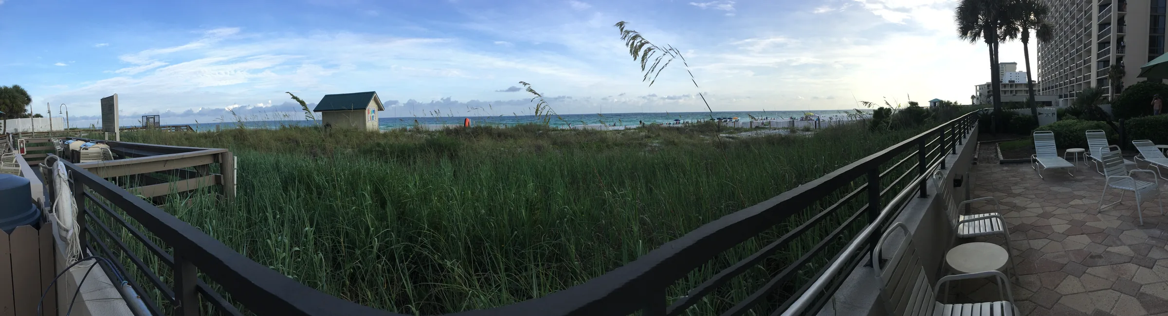Panoramic view of Destin beach, dunes and Gulf water.